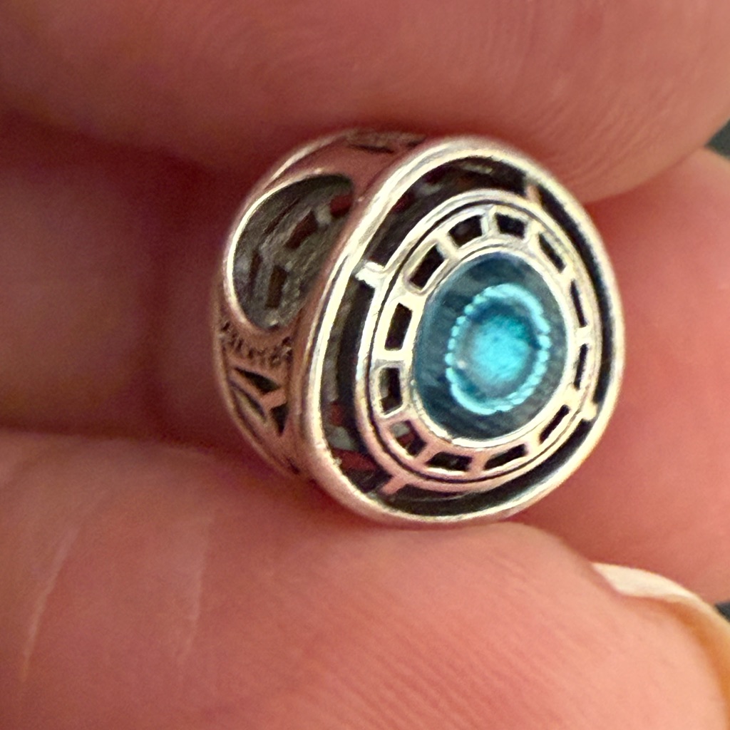 Silver Wearable Charm Accessory With Blue Accent